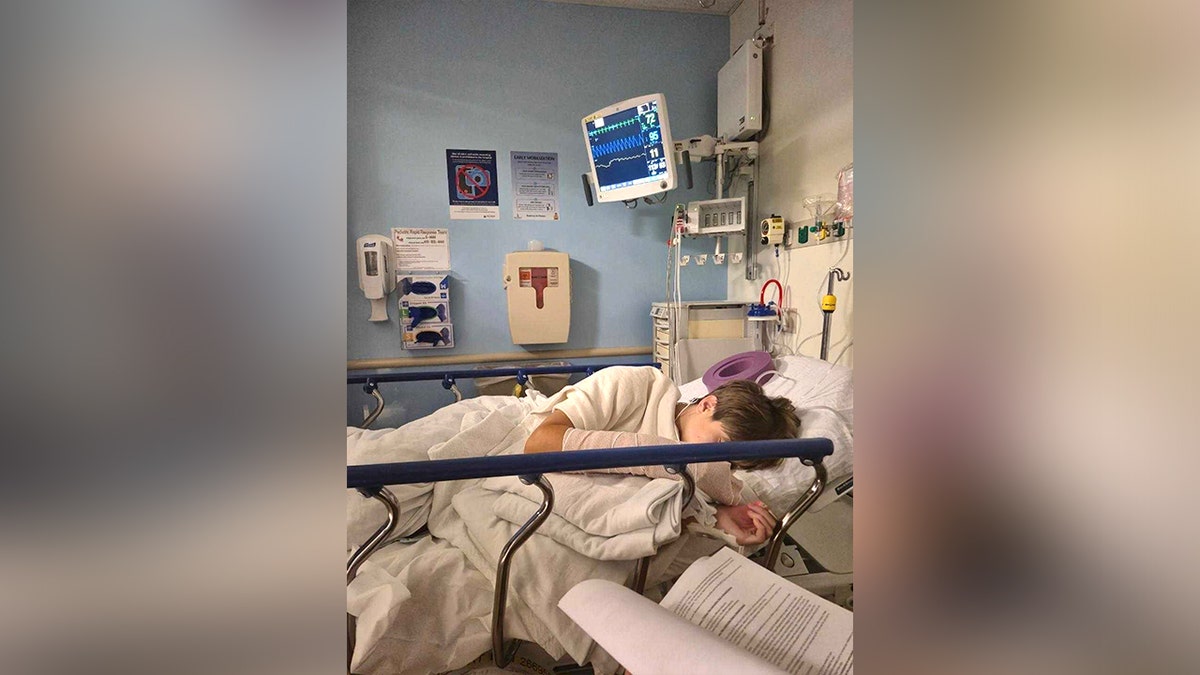 boy in hospital room laying in bed