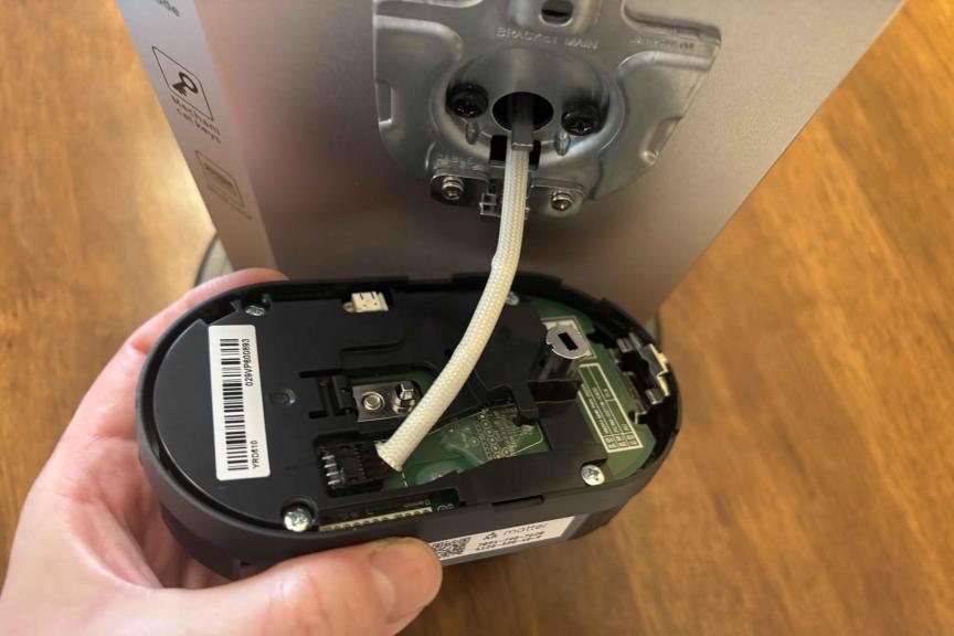 Yale's smart lock showing cable connected to battery unit.